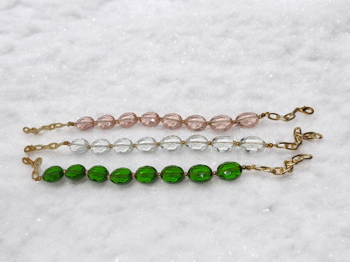 <p data-mce-fragment="1">Handcrafted from sparkling glass crystals, this beaded bracelet adds a touch of elegance to any outfit. With three stunning color options to choose from, you can easily match it to your personal style. The adjustable hook closure ensures a perfect fit, making it both fashionable and functional.</p>