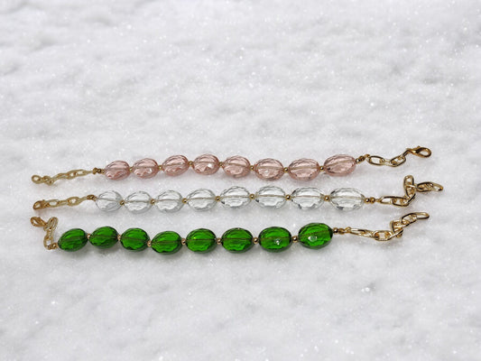 <p data-mce-fragment="1">Handcrafted from sparkling glass crystals, this beaded bracelet adds a touch of elegance to any outfit. With three stunning color options to choose from, you can easily match it to your personal style. The adjustable hook closure ensures a perfect fit, making it both fashionable and functional.</p>