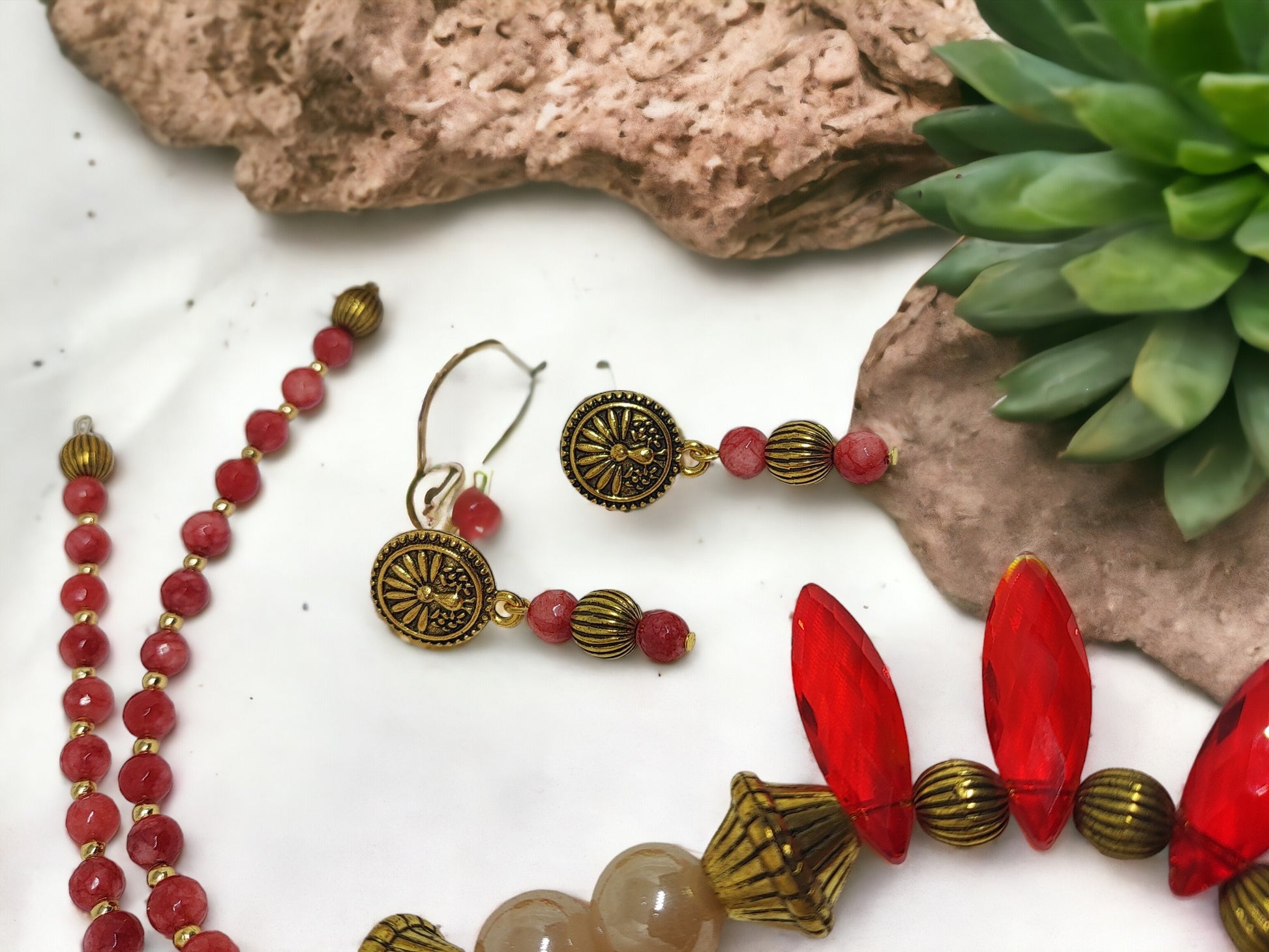 Crafted with high-quality materials, this necklace set boasts deep red glass beads that elevate any ensemble. Its adjustable length ensures versatility for different necklines, making it a timeless piece for any jewelry collection.