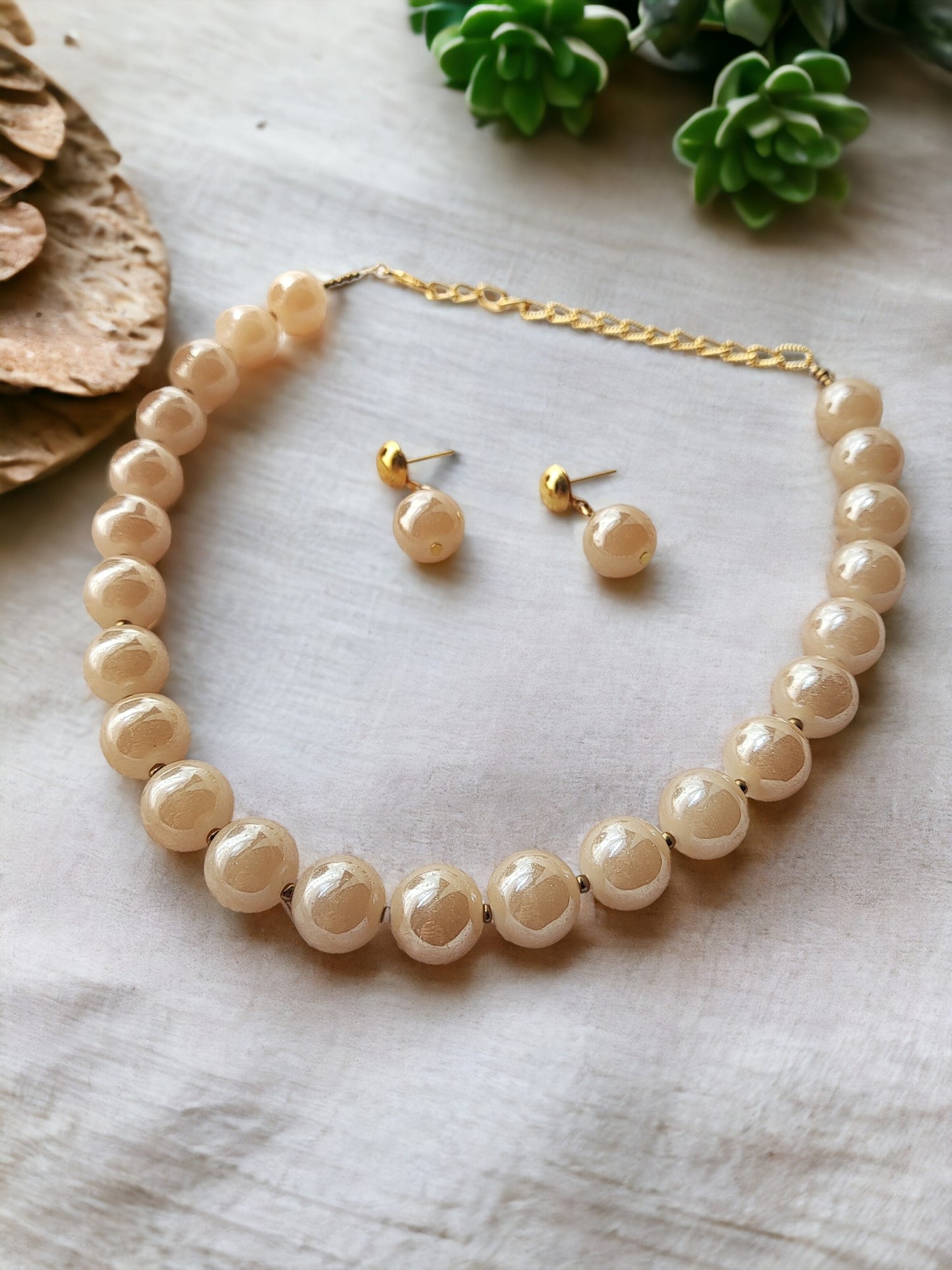 Indulge in luxury with our Glass Pearl Jewellery Set. Dazzling big size beads exude sophistication and elevate any outfit. Handcrafted with precision and premium materials, this set is perfect for both special occasions and daily wear. Upgrade your jewellery collection and make a statement today.