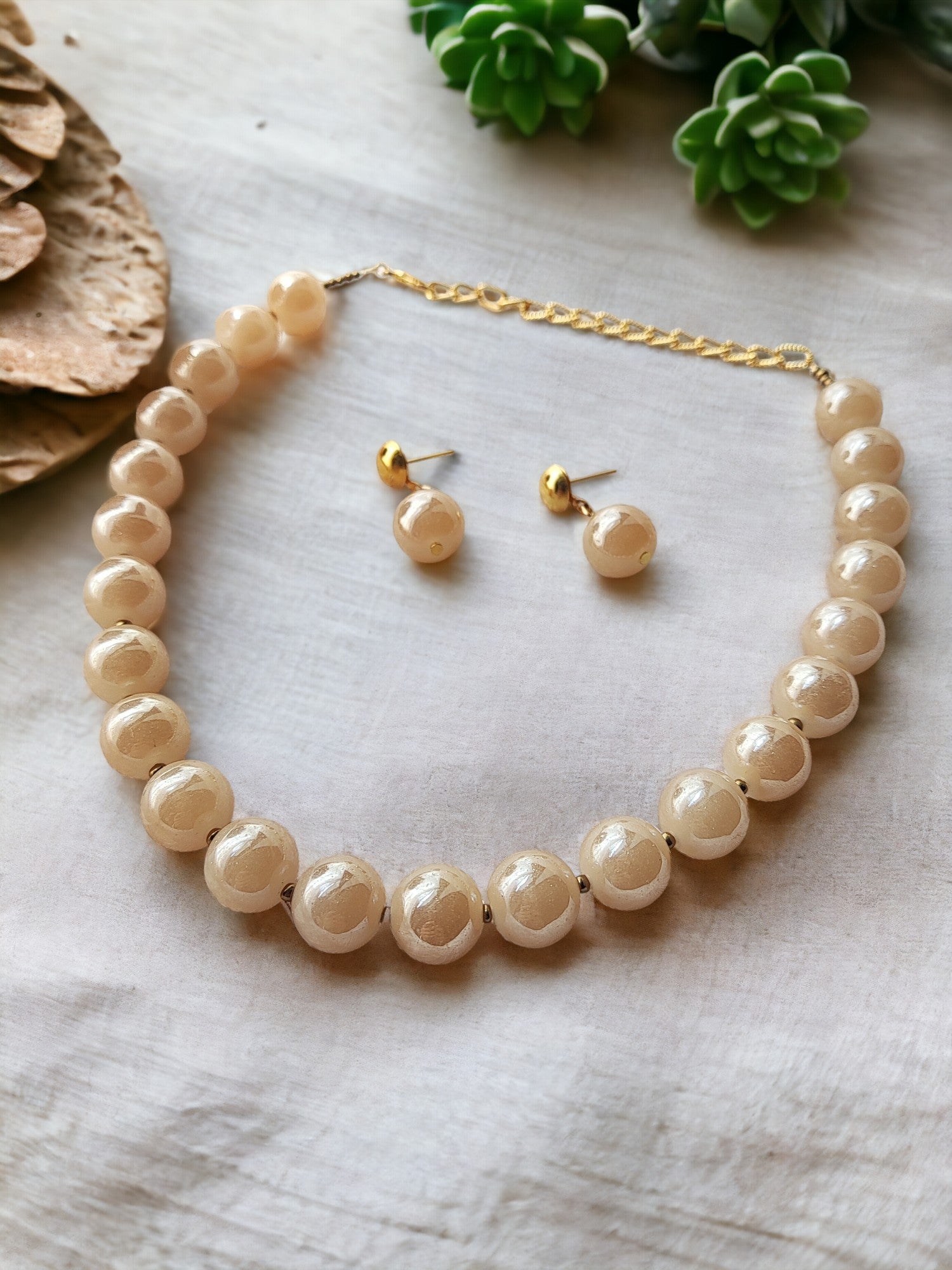 Indulge in luxury with our Glass Pearl Jewellery Set. Dazzling big size beads exude sophistication and elevate any outfit. Handcrafted with precision and premium materials, this set is perfect for both special occasions and daily wear. Upgrade your jewellery collection and make a statement today.