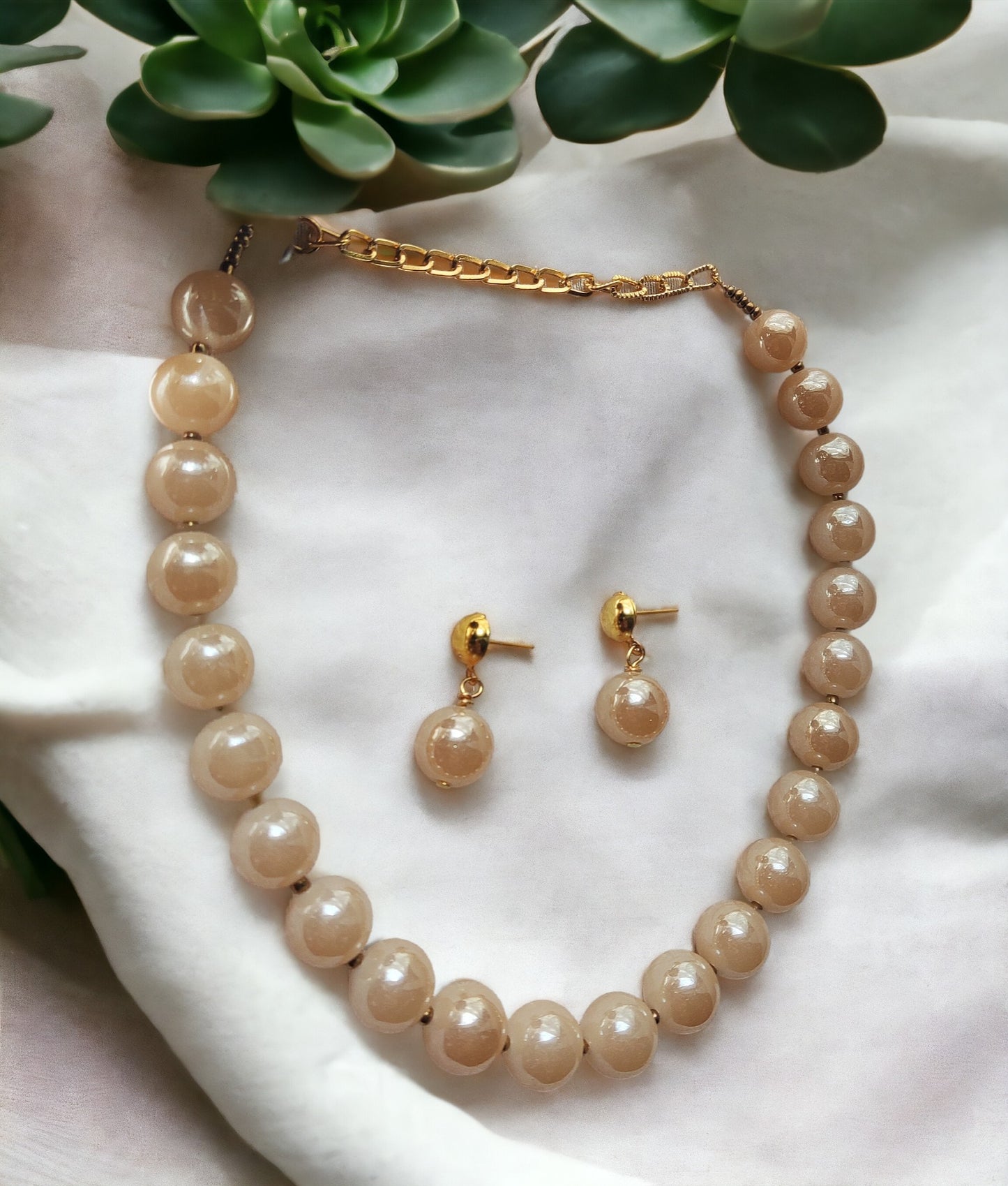 Indulge in luxury with our Glass Pearl Jewellery Set. Dazzling big size beads exude sophistication and elevate any outfit. Handcrafted with precision and premium materials, this set is perfect for both special occasions and daily wear. Upgrade your jewellery collection and make a statement today.