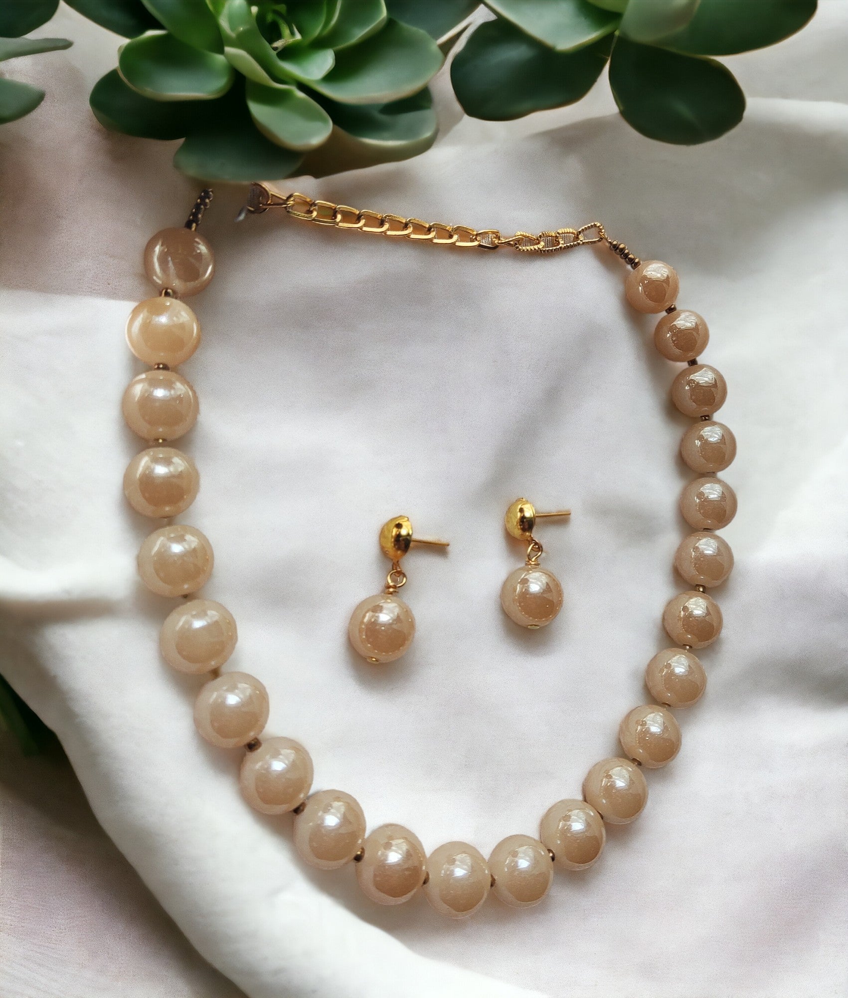 Indulge in luxury with our Glass Pearl Jewellery Set. Dazzling big size beads exude sophistication and elevate any outfit. Handcrafted with precision and premium materials, this set is perfect for both special occasions and daily wear. Upgrade your jewellery collection and make a statement today.
