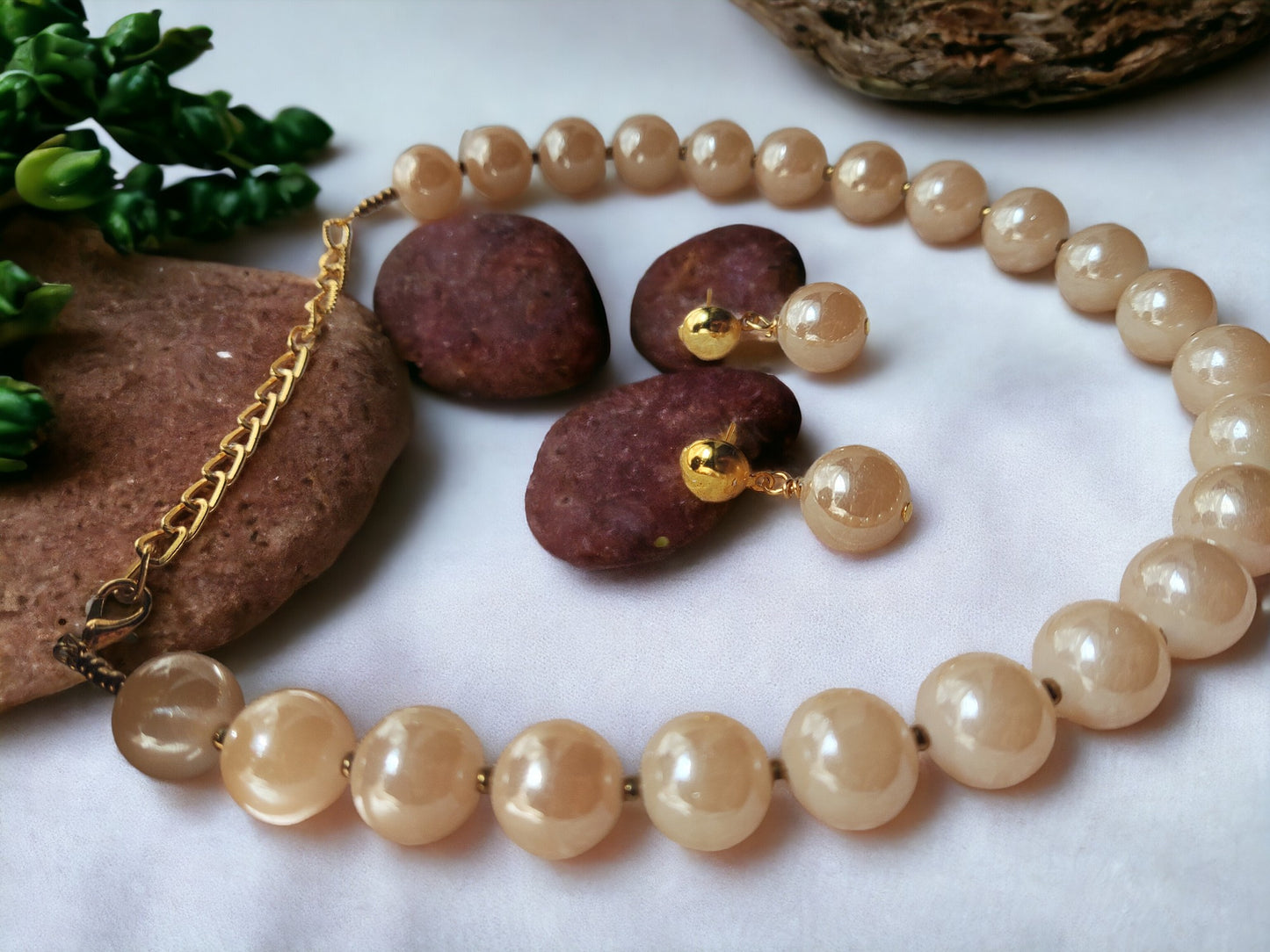 Indulge in luxury with our Glass Pearl Jewellery Set. Dazzling big size beads exude sophistication and elevate any outfit. Handcrafted with precision and premium materials, this set is perfect for both special occasions and daily wear. Upgrade your jewellery collection and make a statement today.