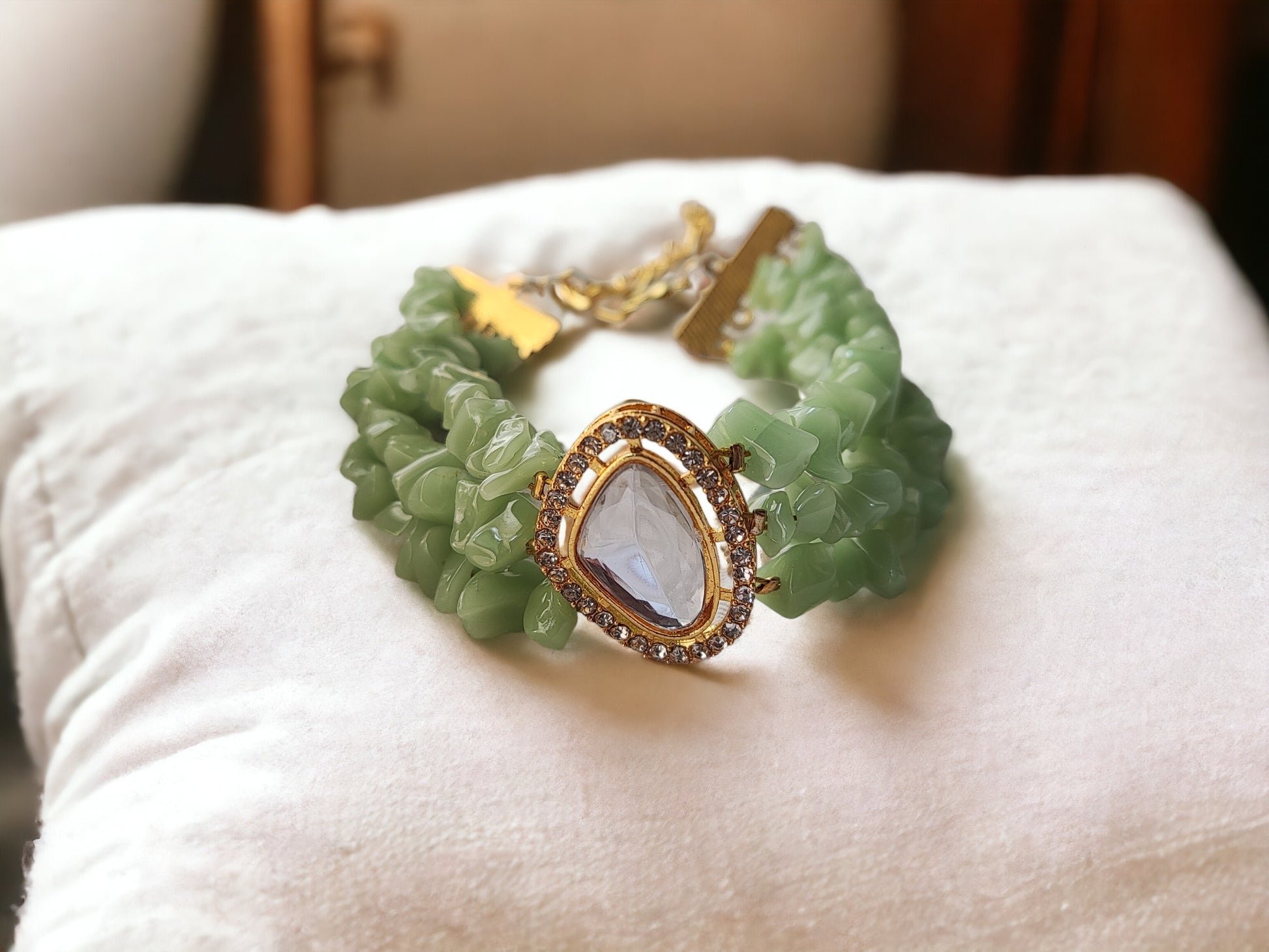 <p data-mce-fragment="1">This exclusive Green Beaded Bracelet is a handmade masterpiece, crafted with stunning chip and kundan beads. The adjustable hook ensures a perfect fit for any wrist. Elevate your style with this elegant and artfully designed bracelet.</p>