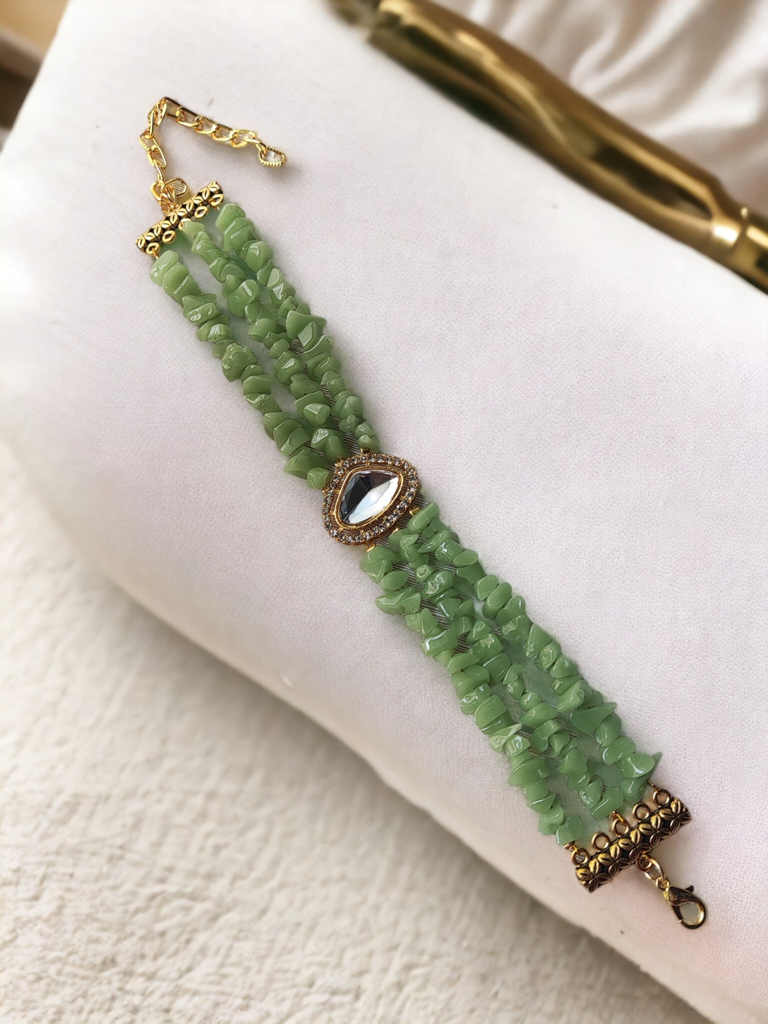 <p data-mce-fragment="1">This exclusive Green Beaded Bracelet is a handmade masterpiece, crafted with stunning chip and kundan beads. The adjustable hook ensures a perfect fit for any wrist. Elevate your style with this elegant and artfully designed bracelet.</p>