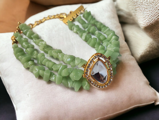<p data-mce-fragment="1">This exclusive Green Beaded Bracelet is a handmade masterpiece, crafted with stunning chip and kundan beads. The adjustable hook ensures a perfect fit for any wrist. Elevate your style with this elegant and artfully designed bracelet.</p>