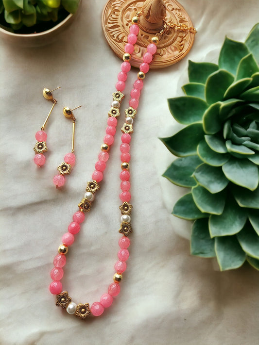 This beautiful pink onyx bead jewellery set is perfect for any occasion. The semi precious beads are lightweight and the adjustable hook makes it comfortable to wear. The set is sure to add a touch of elegance to any look. It is perfect for everyday wear or a special night out.