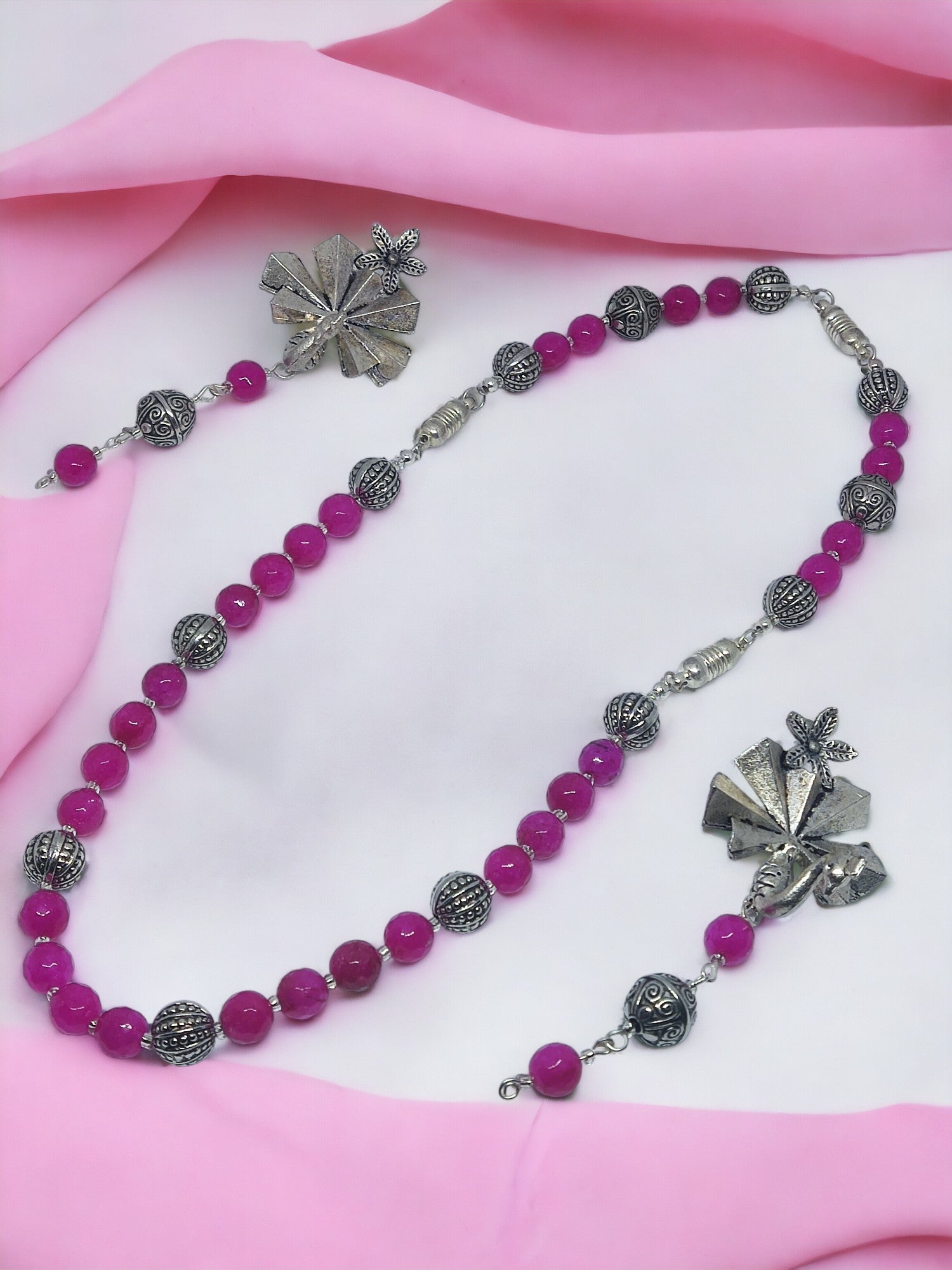 The Indali Pink beaded 5 in 1 jewelry set is a must-have for any fashion-forward woman. Handmade with care, each piece features intricate beading in a soft pink hue. This versatile set offers 5 different styles that can be interchanged to suit your mood and outfit. From casual to formal, you can style this set differently for any occasion. The perfect addition to your jewelry collection