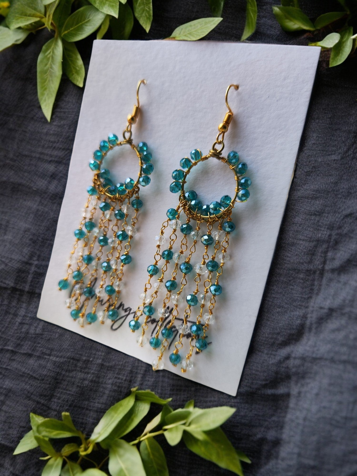 Indulge in luxury with our Eesha Beaded Earrings. Handcrafted with care, these sea blue and white beaded earrings are a stunning display of intricate design. The long length adds sophistication to any outfit, making these a must-have in your jewelry collection. Make a statement and elevate your look with these unique and eye-catching earrings.