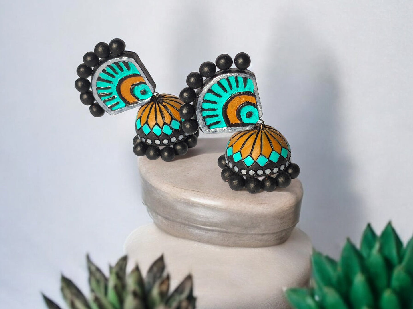 Aachal ethnic terracotta jhumka earrings with turquoise and orange detailing by Anusangi Collections