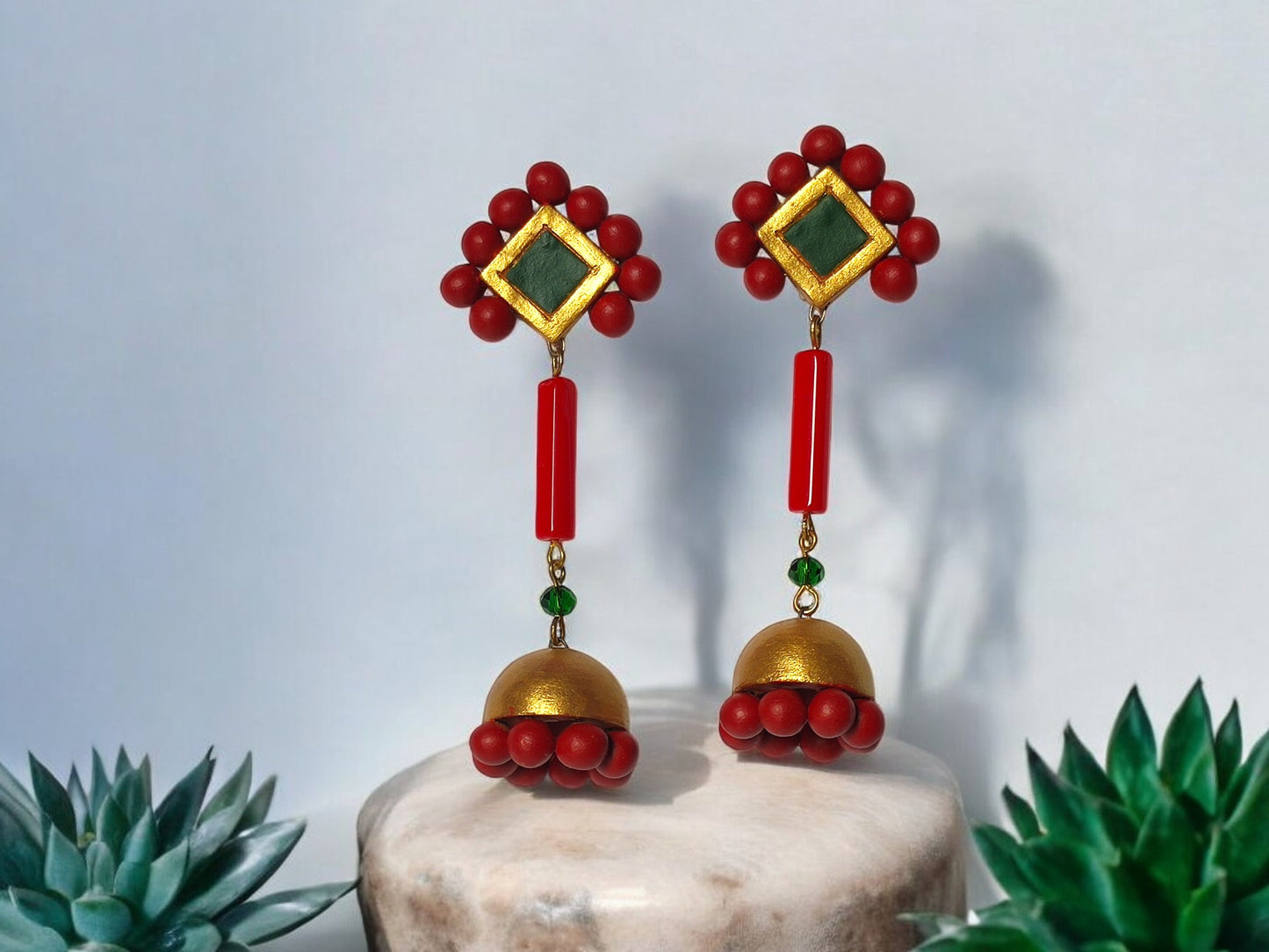 Anusangi Collections Abha statement dangle earrings in terracotta with red and gold design