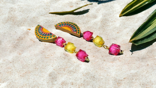 Anusangi Collections terracotta Amira statement earrings for women with colorful beads on sandy background