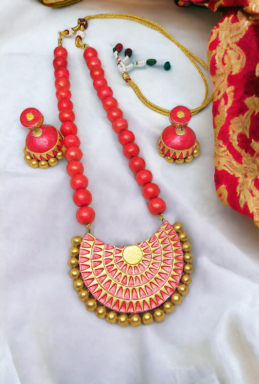 Anya terracotta jewelry set by Anusangi Collections featuring red beads necklace and matching earrings