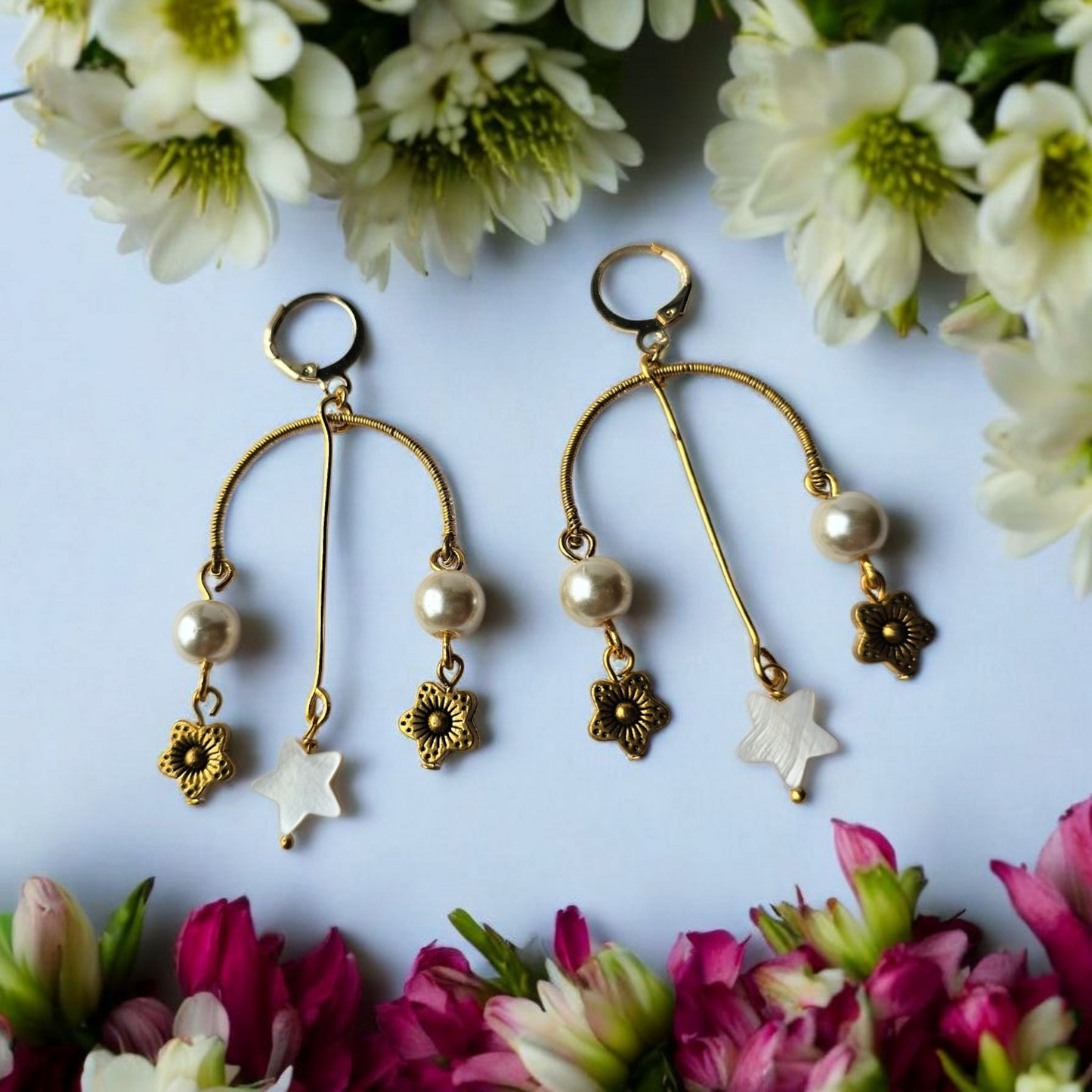 Anusangi Collections artisanal beaded earrings India with gold tone, pearls, and floral charms