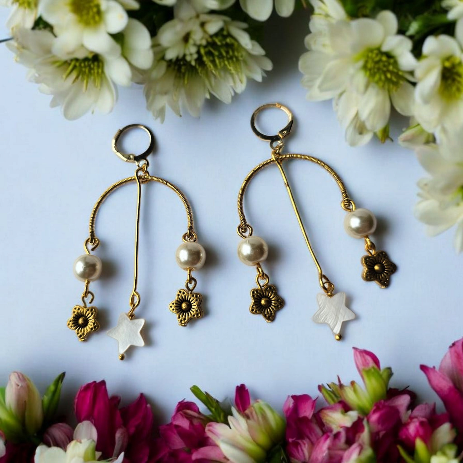 Anusangi Collections artisanal beaded earrings India with gold tone, pearls, and floral charms