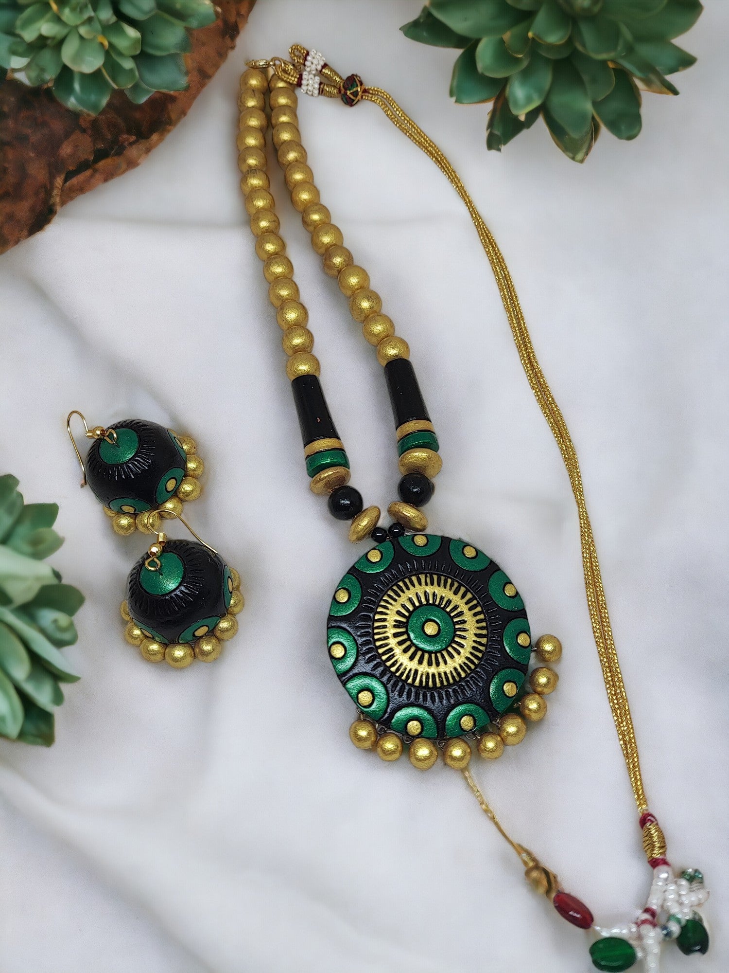 Black and gold terracotta necklace with matching earrings from Anusangi Collections in green and gold design