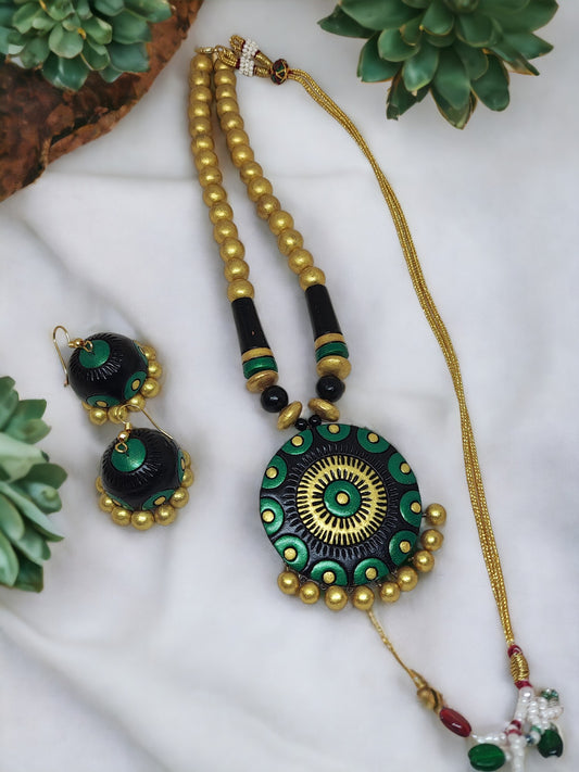 Black and gold terracotta necklace with matching earrings from Anusangi Collections in green and gold design