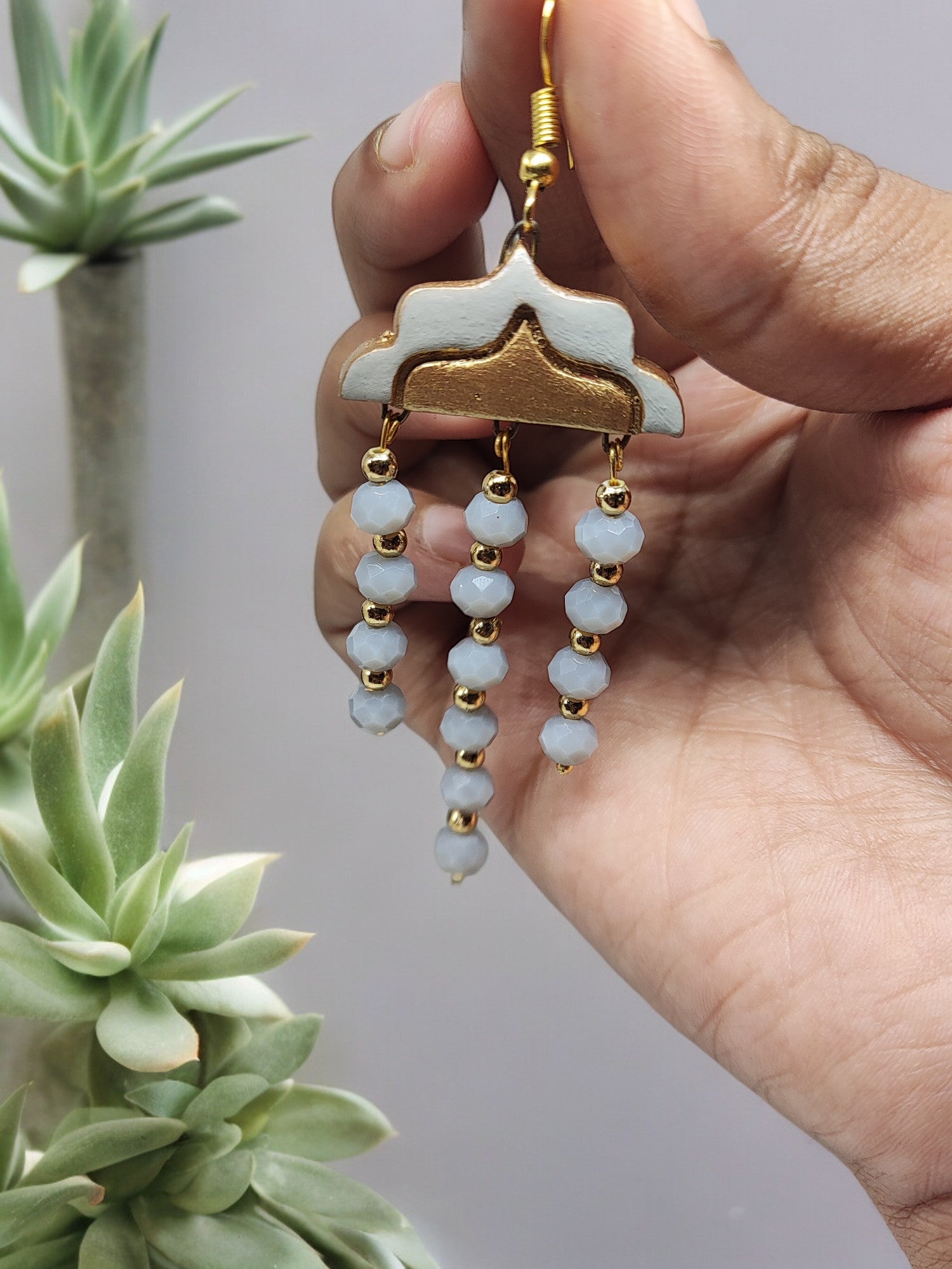 Boho chic gray terracotta earrings from Anusangi Collections with gold accents and bead dangles