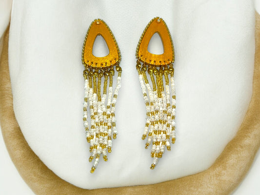 Boho gold beaded earrings from Anusangi Collections with white and gold beaded tassel design
