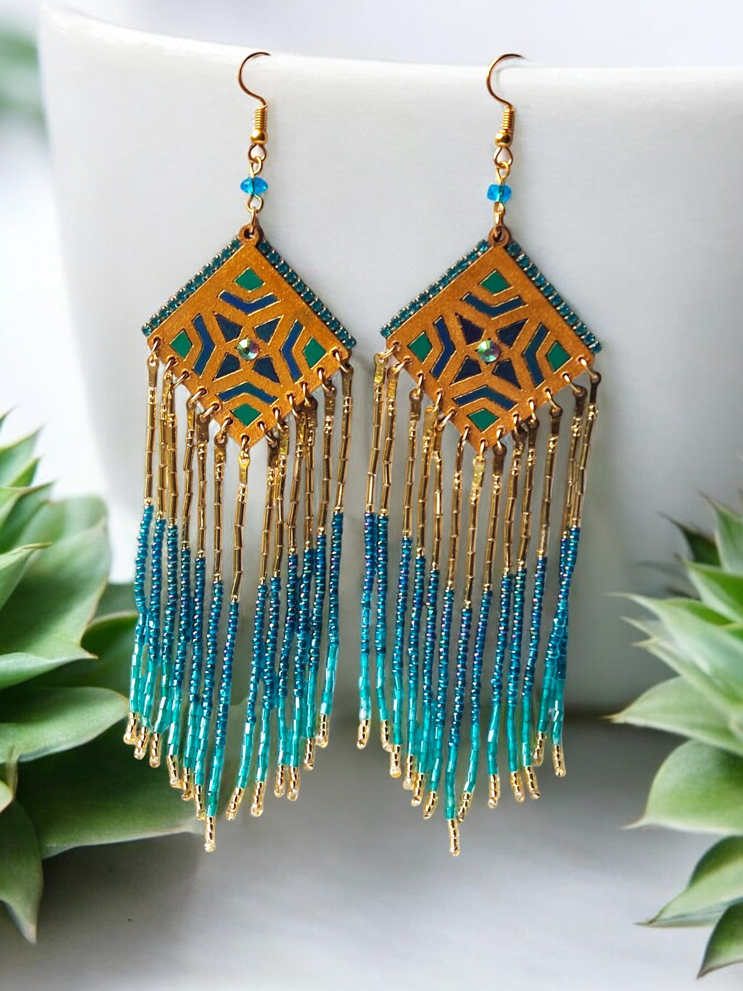 Boho statement beaded earrings from Anusangi Collections featuring gold and turquoise fringe design
