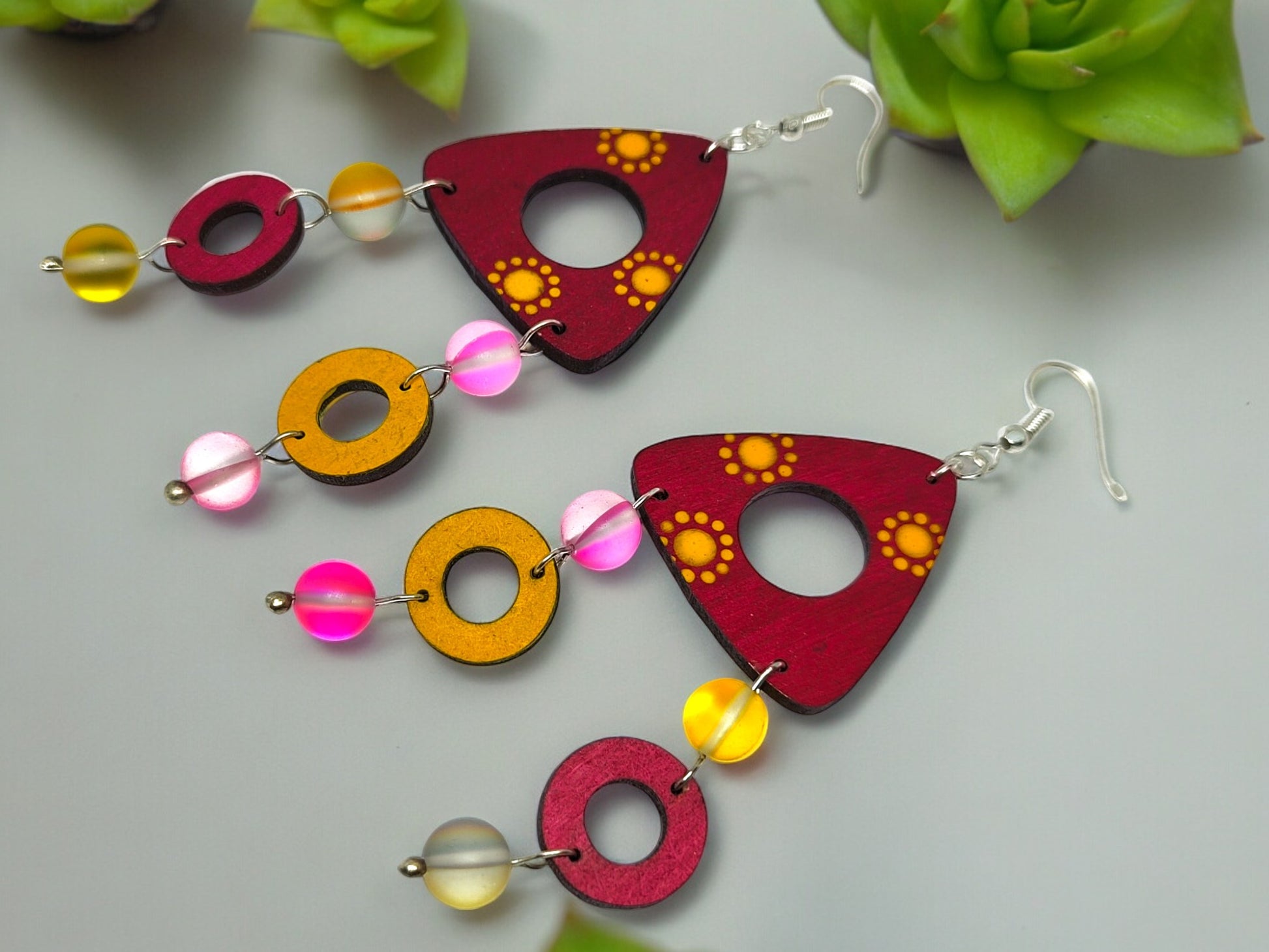 Colorful terracotta earrings for women with red and yellow geometric patterns and beaded accents