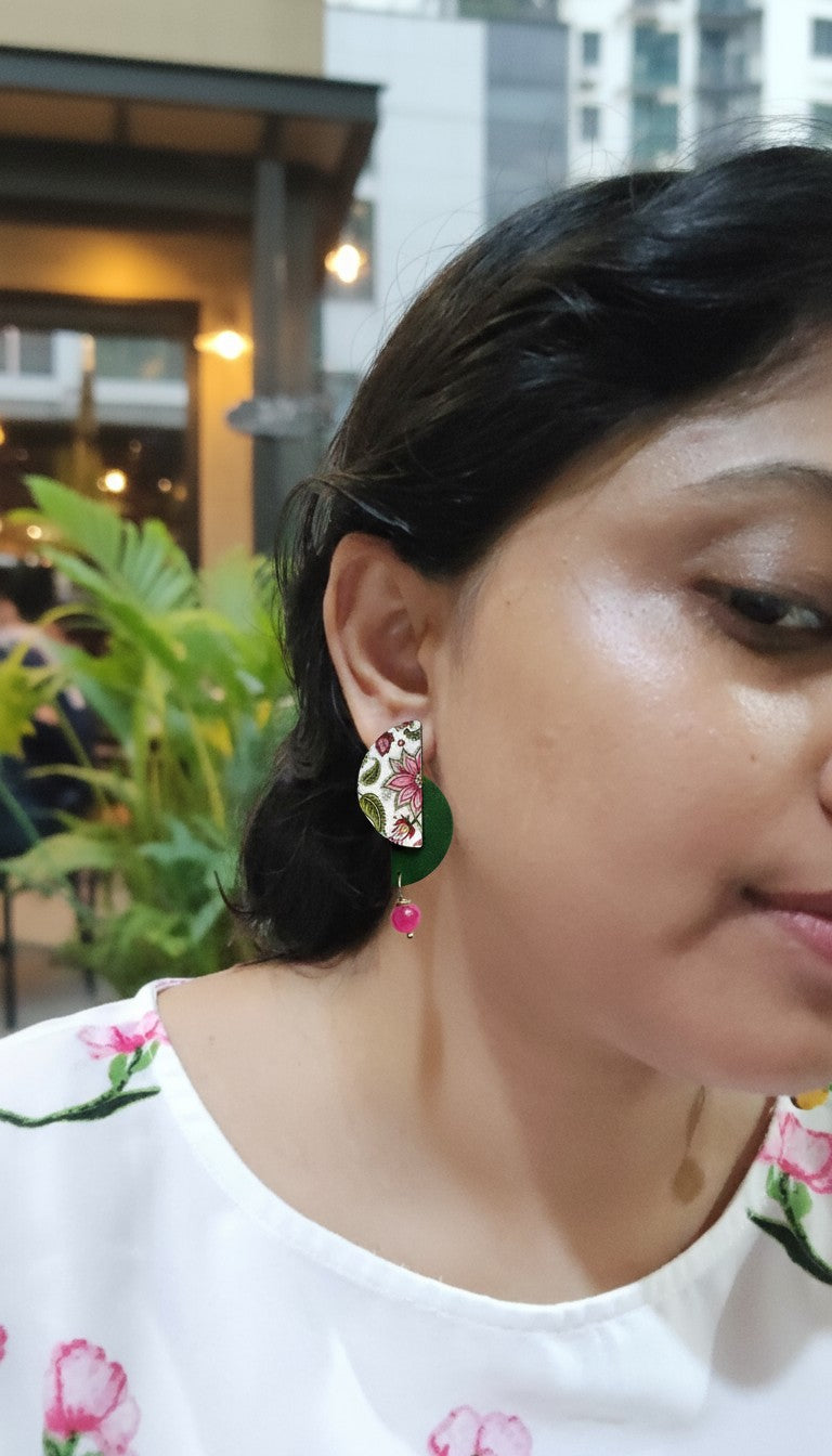 Floral pink wooden earrings from Anusangi Collections, vibrant design with beads and a decorative floral pattern