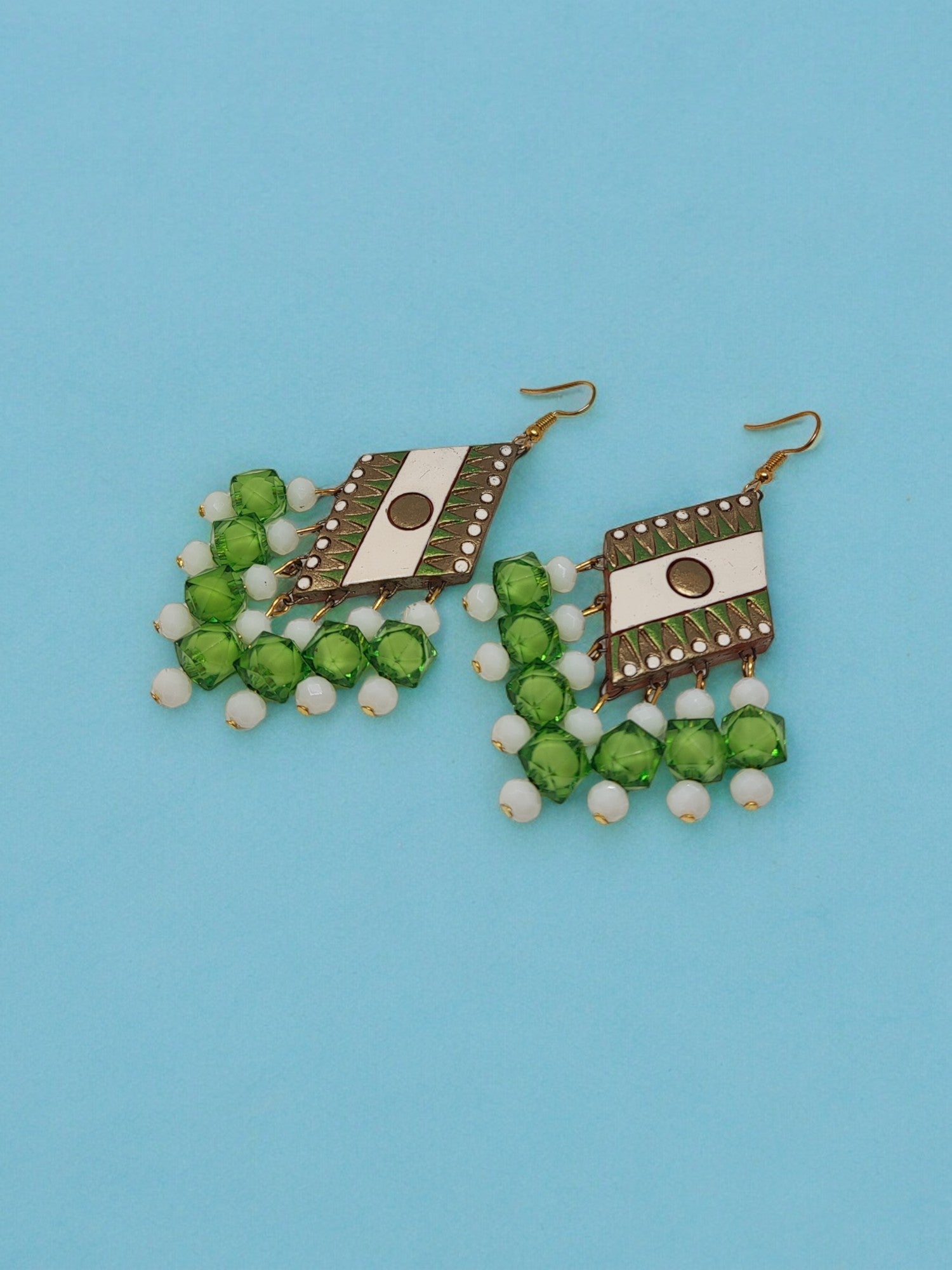 Green geometric design terracotta earrings with white beads from Anusangi Collections