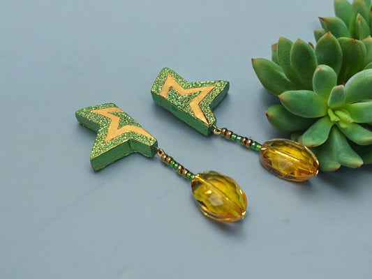 Green terracotta earrings with star design and yellow bead drops from Anusangi Collections