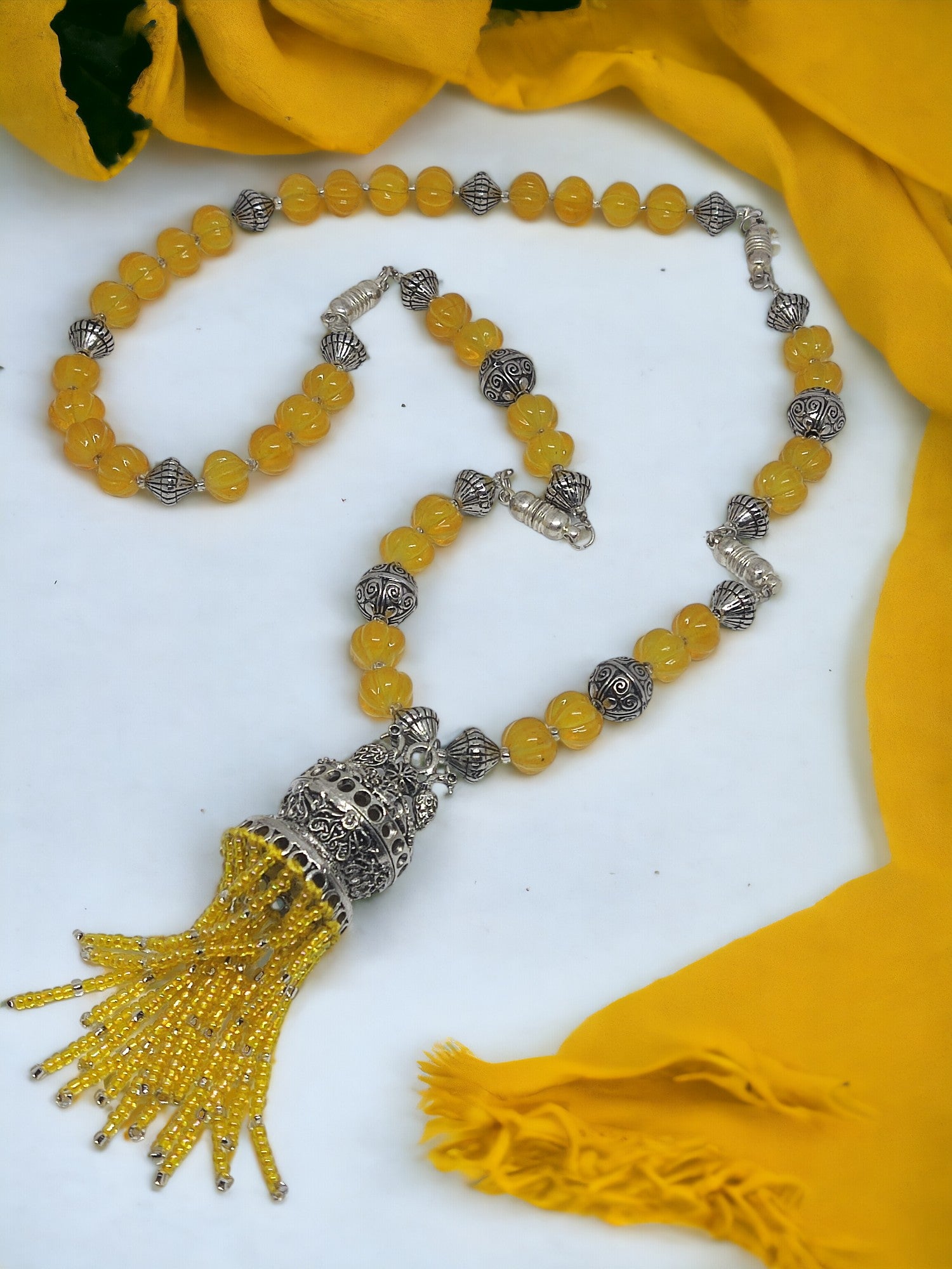 Handmade beaded jewelry set with yellow beads and silver accents from Anusangi Collections