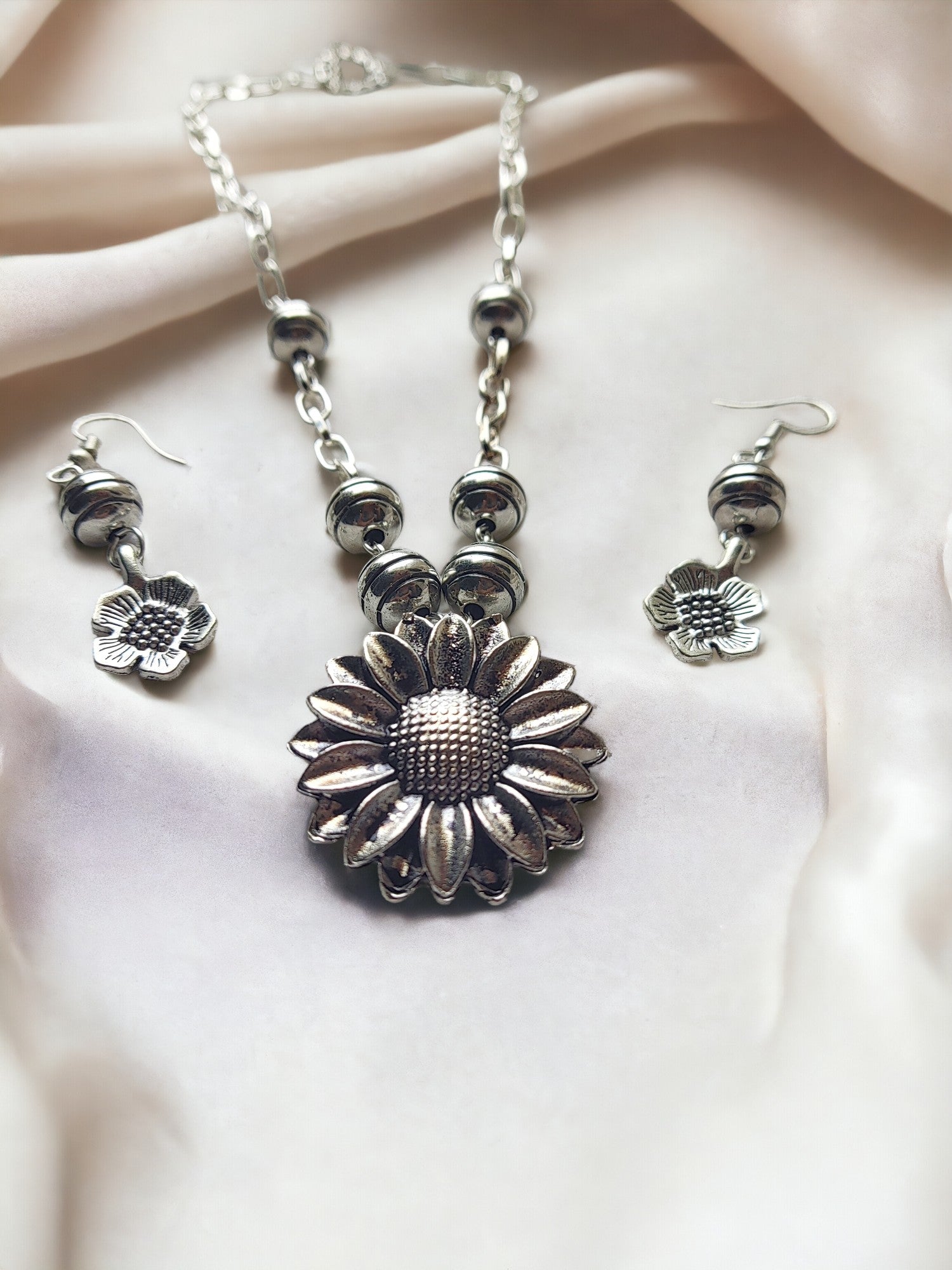 Anusangi Collections handmade daily wear jewelry silver sunflower necklace and matching earrings set