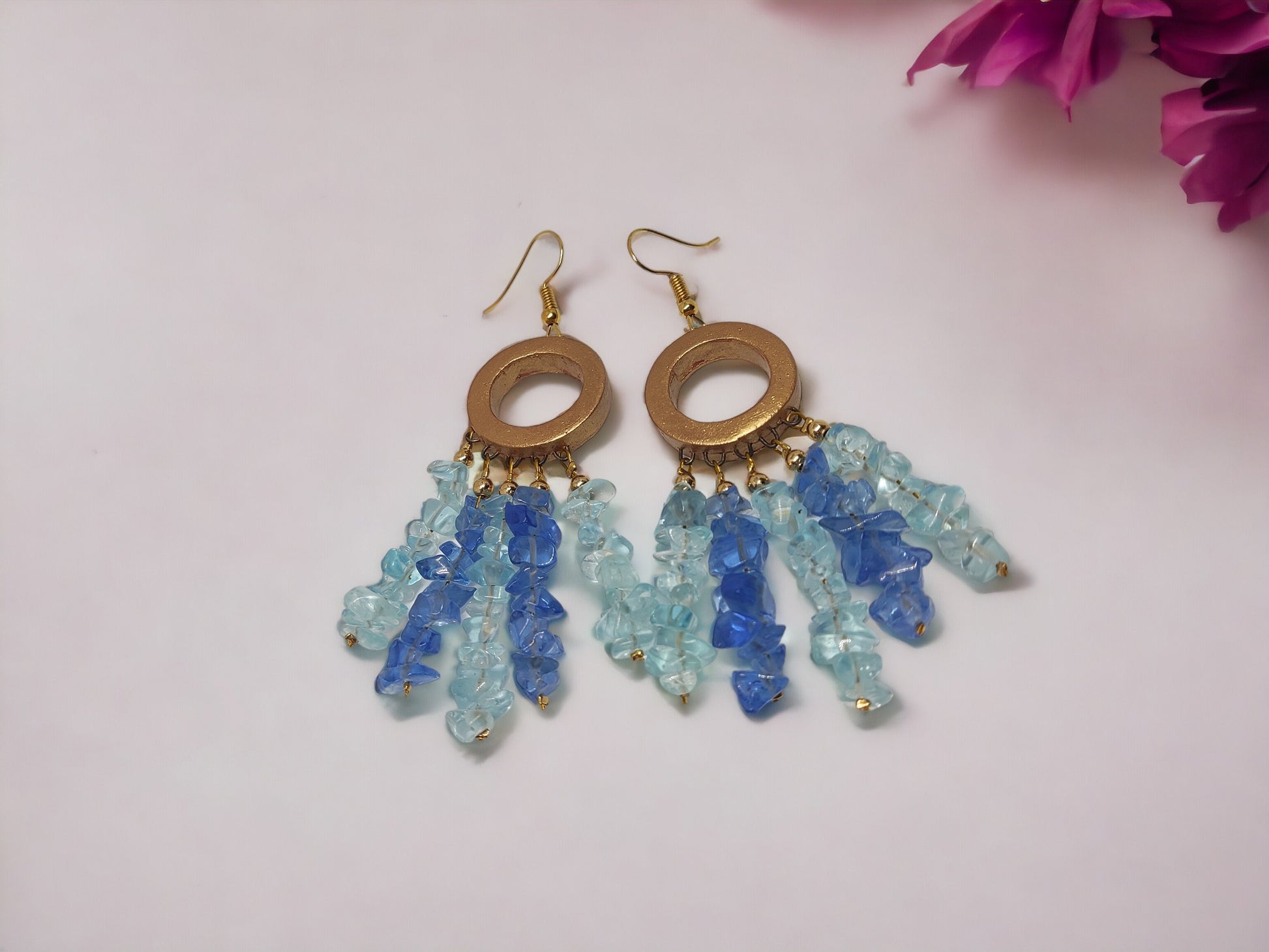 Anusangi Collections handmade dreamcatcher earrings with blue and light blue beads and circular gold frames