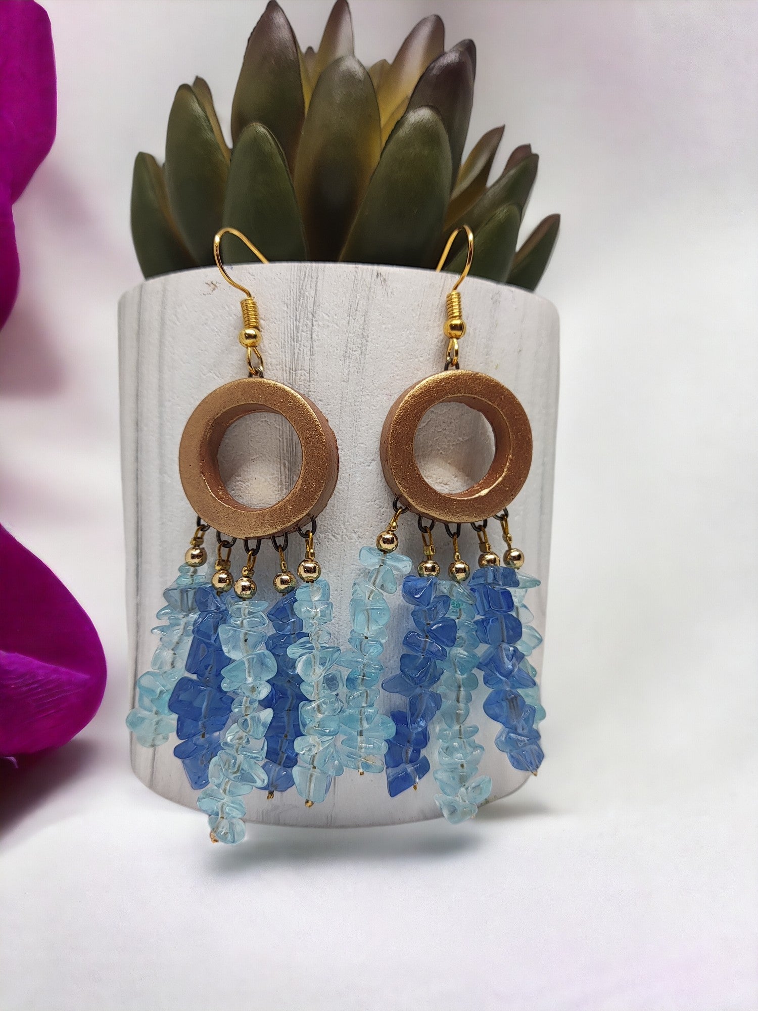 Handmade dreamcatcher earrings by Anusangi Collections with blue beaded tassels and wooden circular hoops