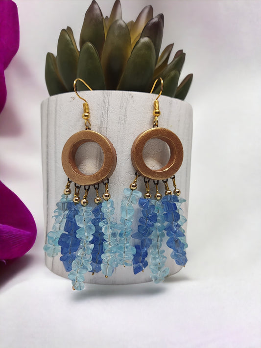 Handmade dreamcatcher earrings by Anusangi Collections with blue beaded tassels and wooden circular hoops