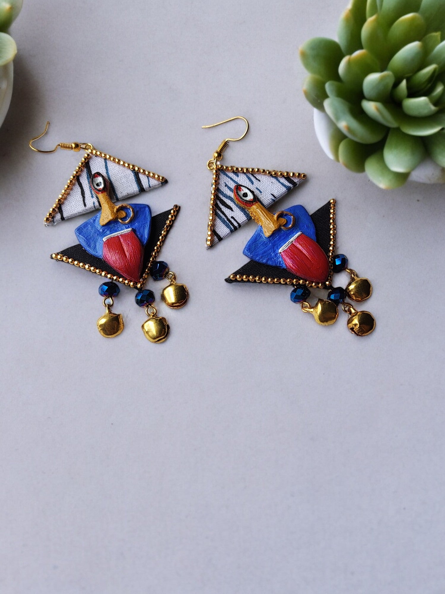 Anusangi Collections handmade fabric earrings featuring colorful geometric design with gold accents and blue beads