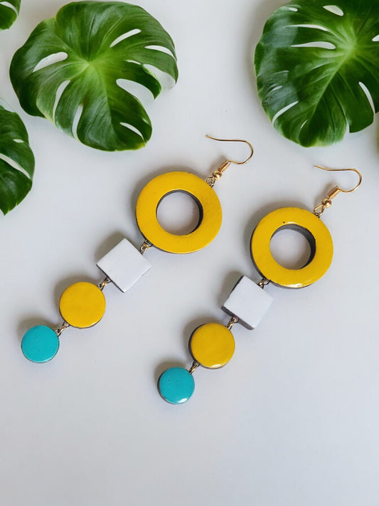 Anusangi Collections handmade terracotta earrings in yellow white and turquoise geometric design