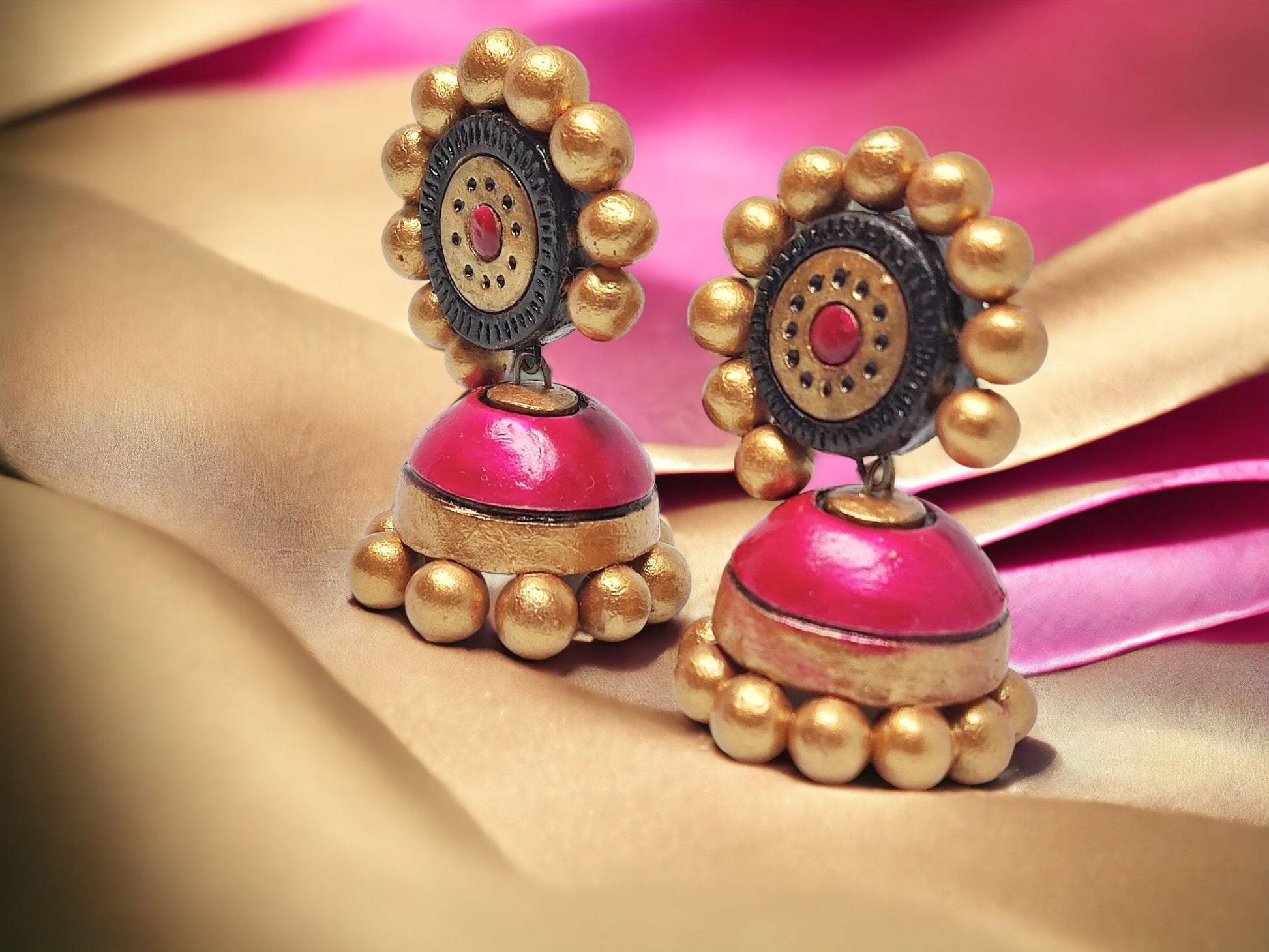 Handmade terracotta pink jhumka earrings from Anusangi Collections with gold bead detailing