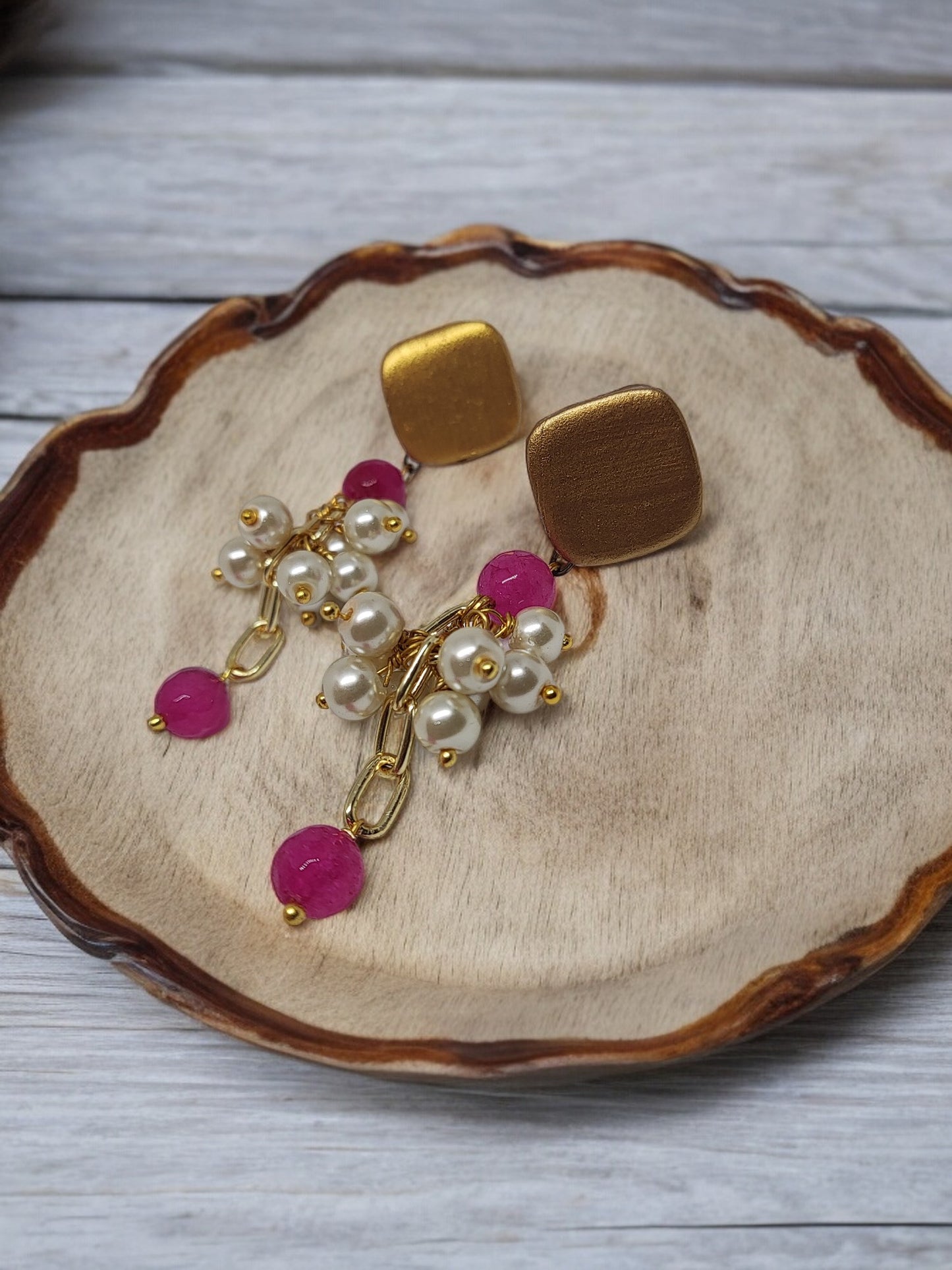 Ishana terracotta earrings by Anusangi Collections featuring gold square studs with pearl and pink bead dangles