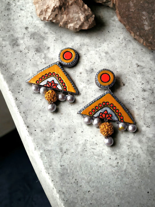 Anusangi Collections Kasturi terracotta jewelry yellow triangle earrings with orange and silver bead accents
