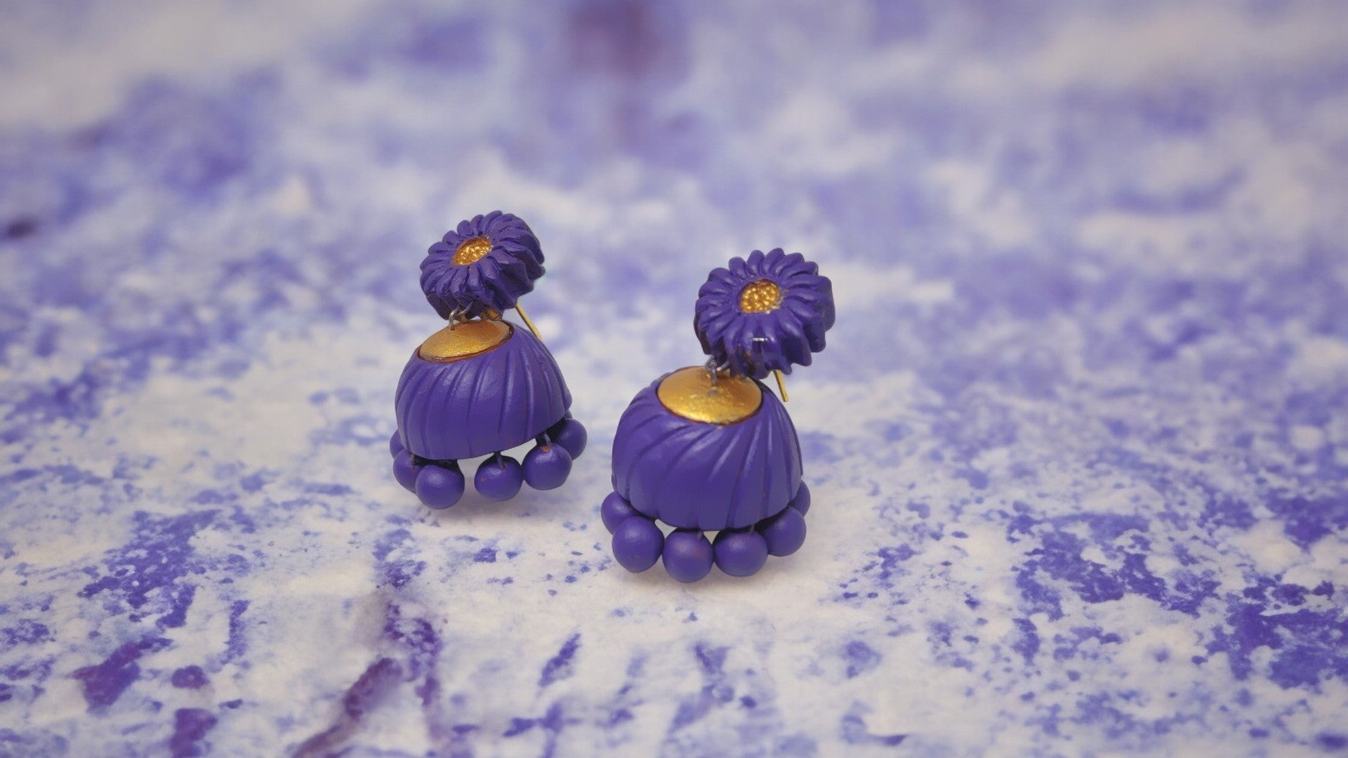Lavender terracotta earrings from Anusangi Collections with floral stud and round bead details