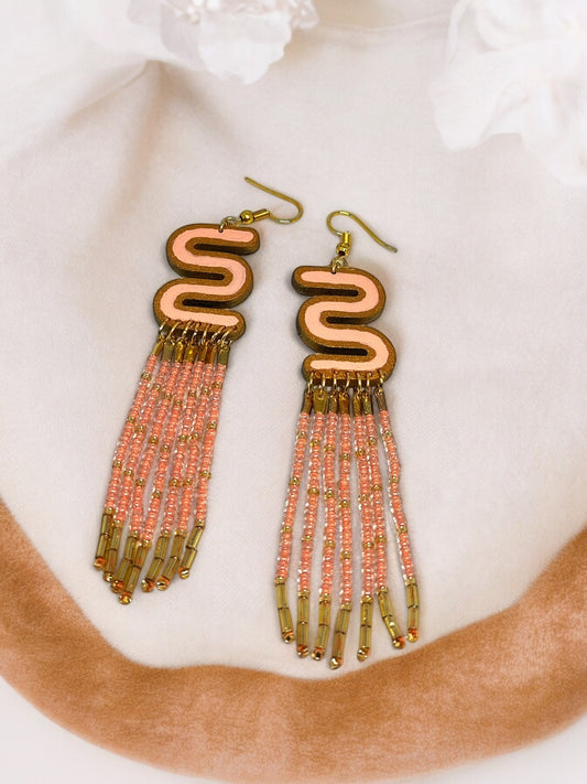 Long beaded earrings for women with pink and gold beads and unique swirl design by Anusangi Collections
