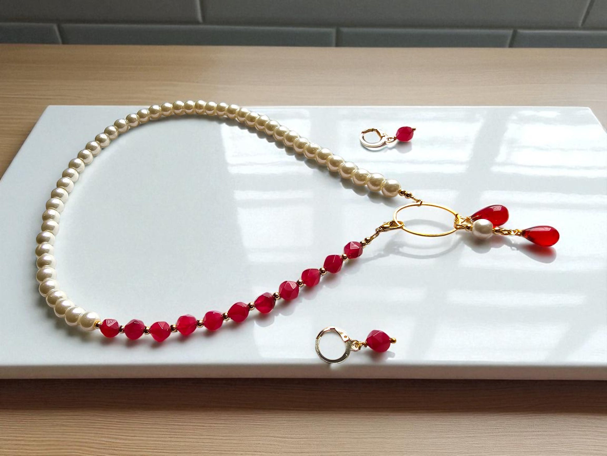 Maroon and pearl jewelry set with elegant beaded necklace and matching earrings from Anusangi Collections