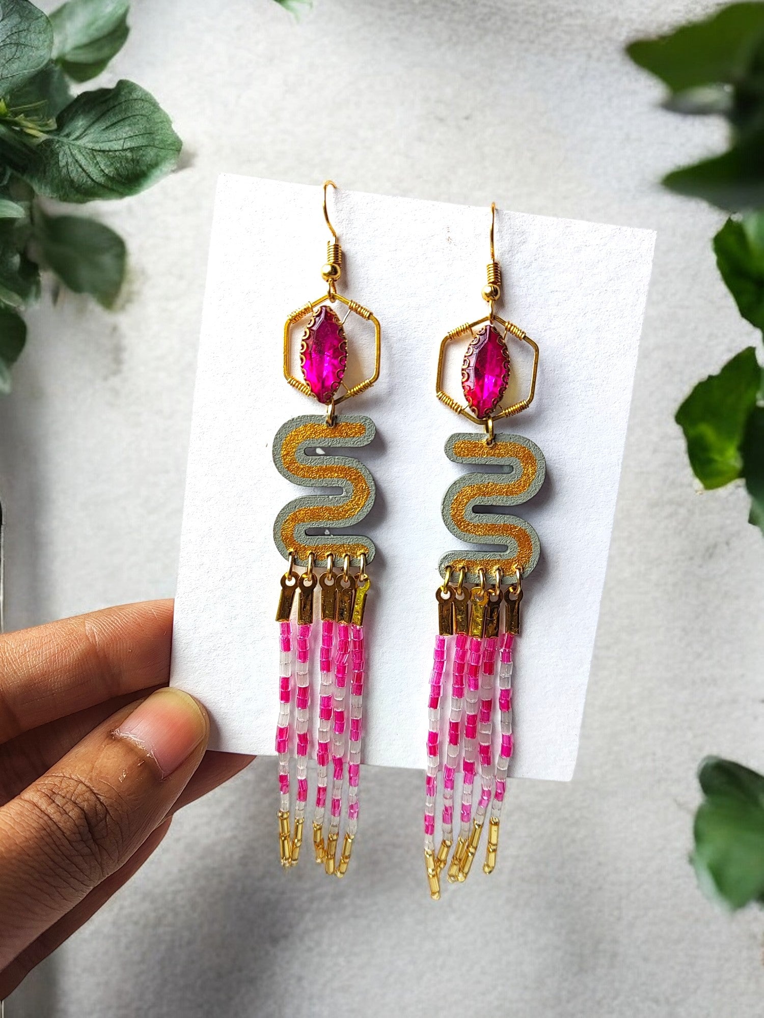 Anusangi Collections pink and gold dangle earrings with intricate bead design and elegant hanging strands