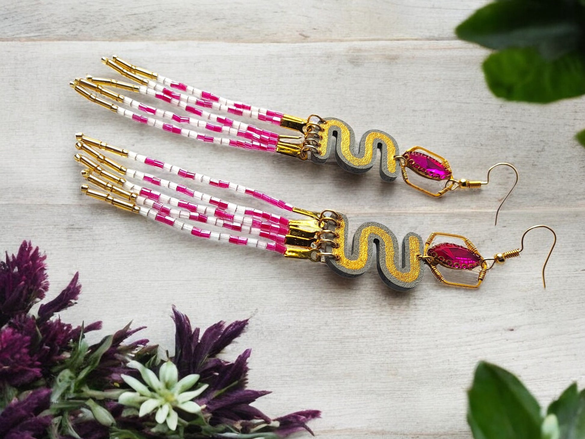 Pink and gold dangle earrings with beaded design and elegant tassel detailing from Anusangi Collections