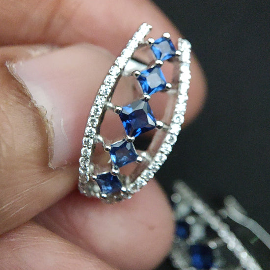 Bishakha Sterling silver earrings. made of silver, High Quaility AD Diamonds and princess cut stone Blue in color