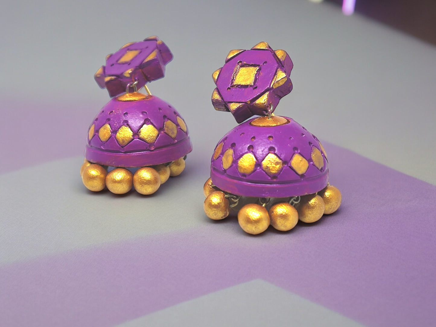 Purple terracotta earrings with golden accents and round gold beads from Anusangi Collections