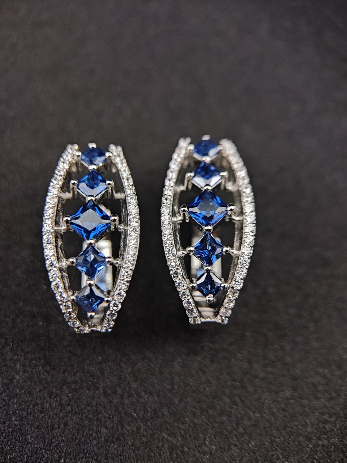 Bishakha Sterling silver earrings. made of silver, High Quaility AD Diamonds and princess cut stone Blue in color