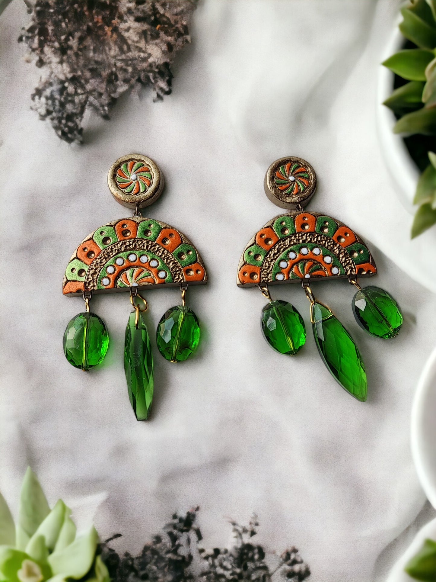 Shakuntala terracotta earrings by Anusangi Collections featuring green and orange design with hanging green beads