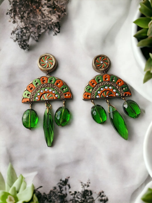 Shakuntala terracotta earrings by Anusangi Collections featuring green and orange design with hanging green beads