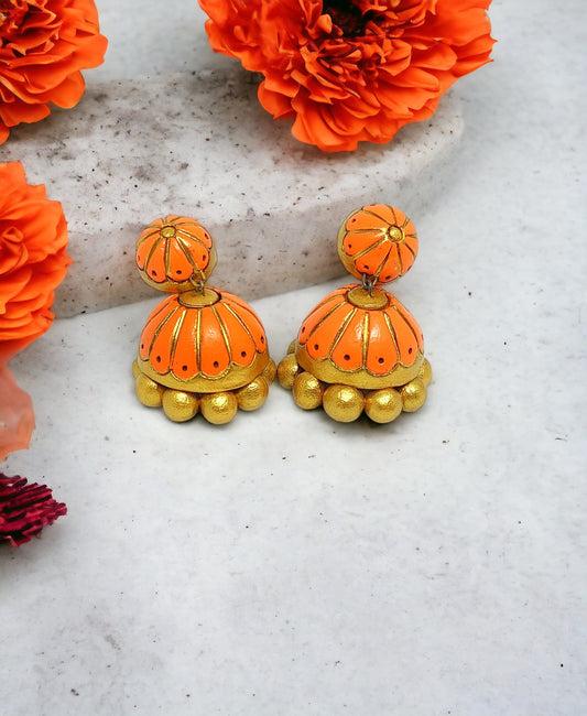 Orange and gold terracotta jhumka earrings from Anusangi Collections with floral design
